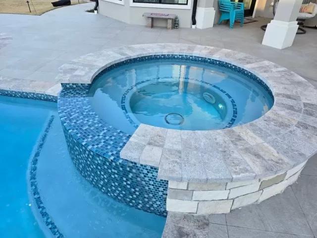 Luxury spa pool built within swimming pool - Diamond Pools AR