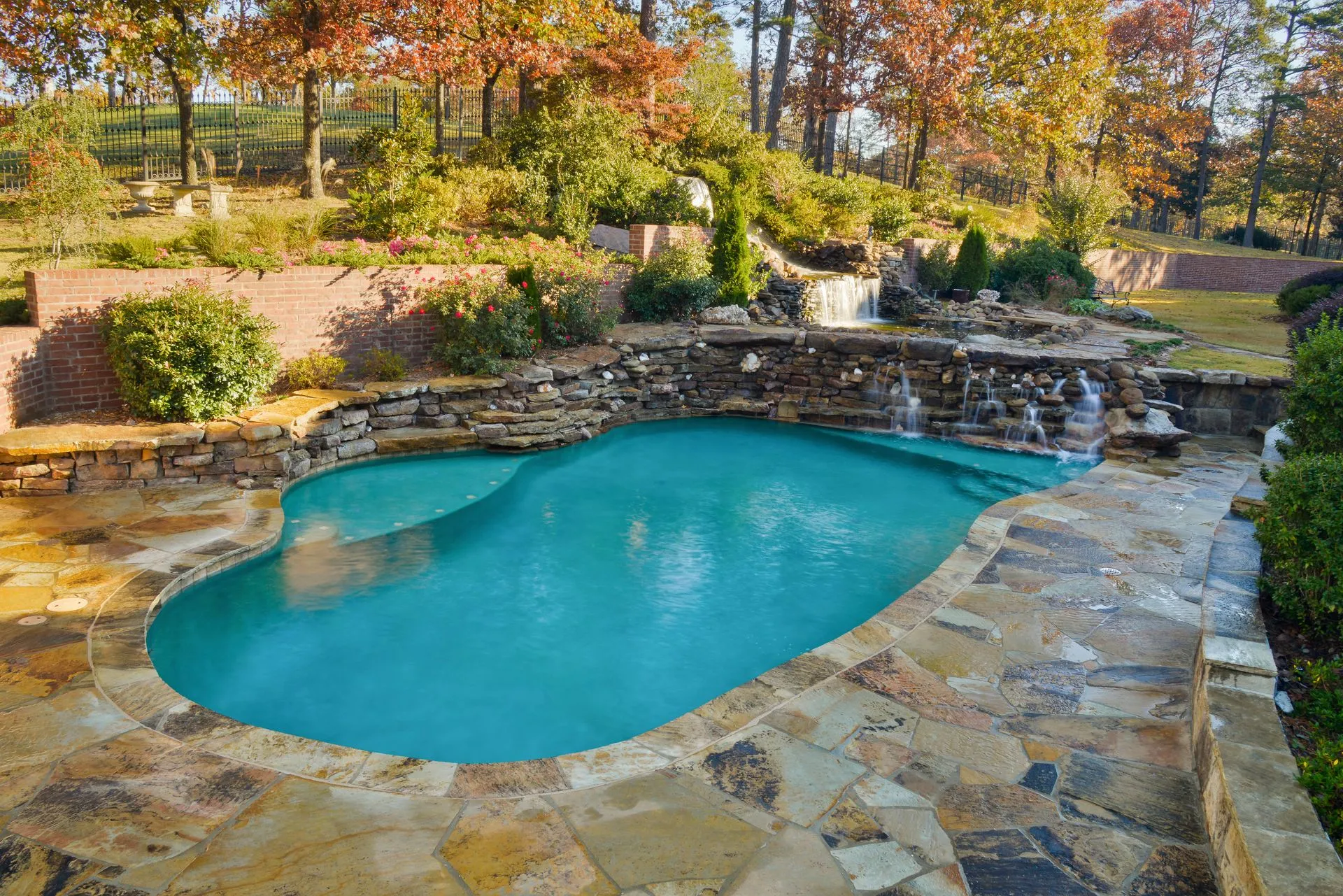 luxury freeform swimming pool and spa built from stone - Diamond Pools AR